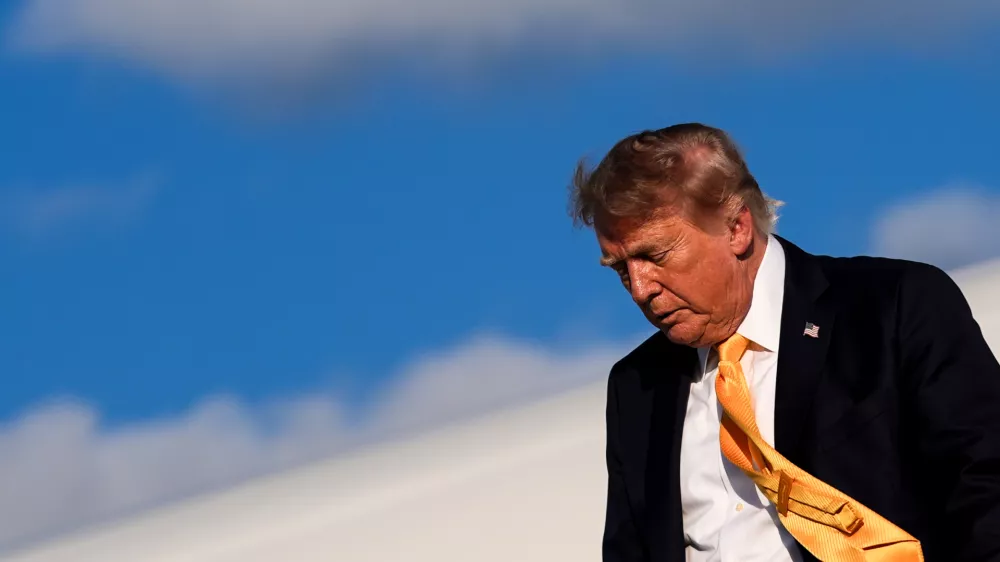 President Donald Trump disembarks Air Force One at Morristown Airport, Friday, Sept. 4, 2026, in Morristown, N.J. (AP Photo/Julia Demaree Nikhinson)
