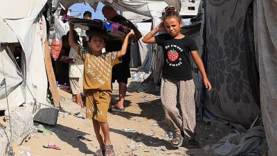 Palestinian children walk at a tent camp sheltering displaced people, in Gaza City, September 4, 2026. REUTERS/Dawoud Abu Alkas