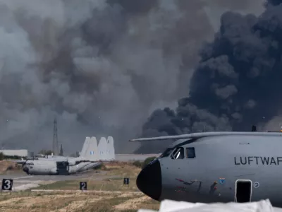 Smoke rises after a Hellenic Air Force F-4 Phantom fighter jet crashed, during the Athens Flying Week airshow at Tanagra Air Force Base, north of Athens, Greece, Saturday, Sept. 5, 2026. (AP Photo)