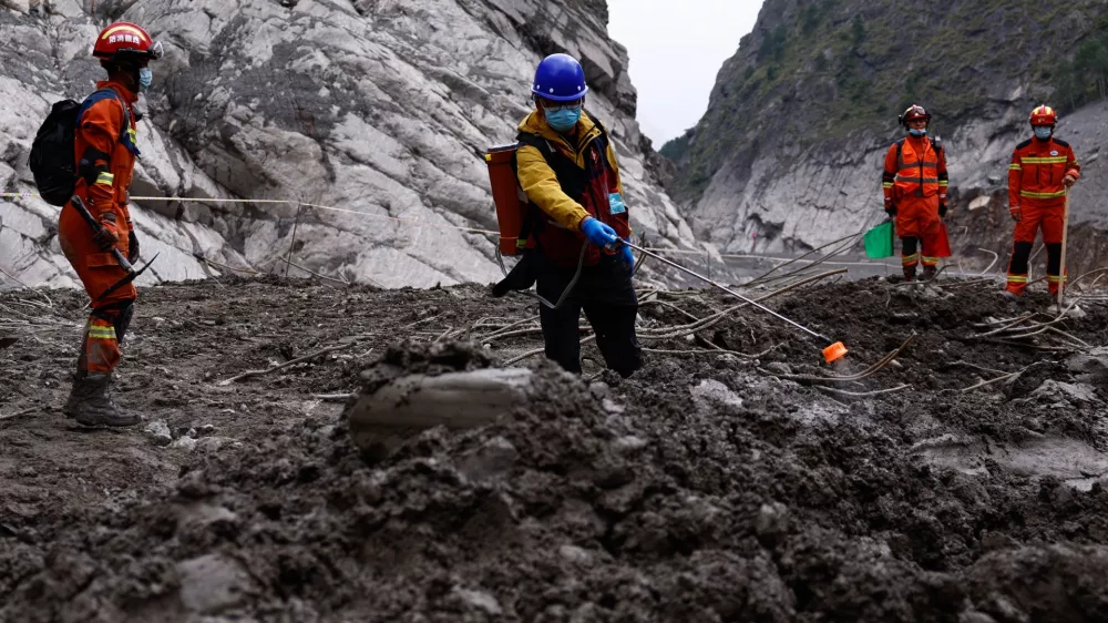Rescue workers conduct search and rescue operations at the core disaster-hit area at Gyirong Port during an organised media tour in Shigatse, Tibet Autonomous Region, China, Sunday Sept. 6, 2026. (Tingshu Wang/Pool Photo via AP)