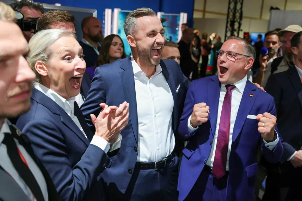 Top candidate of the far-right Alternative for Germany (AfD), Ulrich Siegmund, with party co leaders Alice Weidel and Tino Chrupalla, reacts after polls closed, on the day of the Saxony-Anhalt state elections, in Magdeburg, Germany, September 6, 2026. REUTERS/Fabrizio Bensch