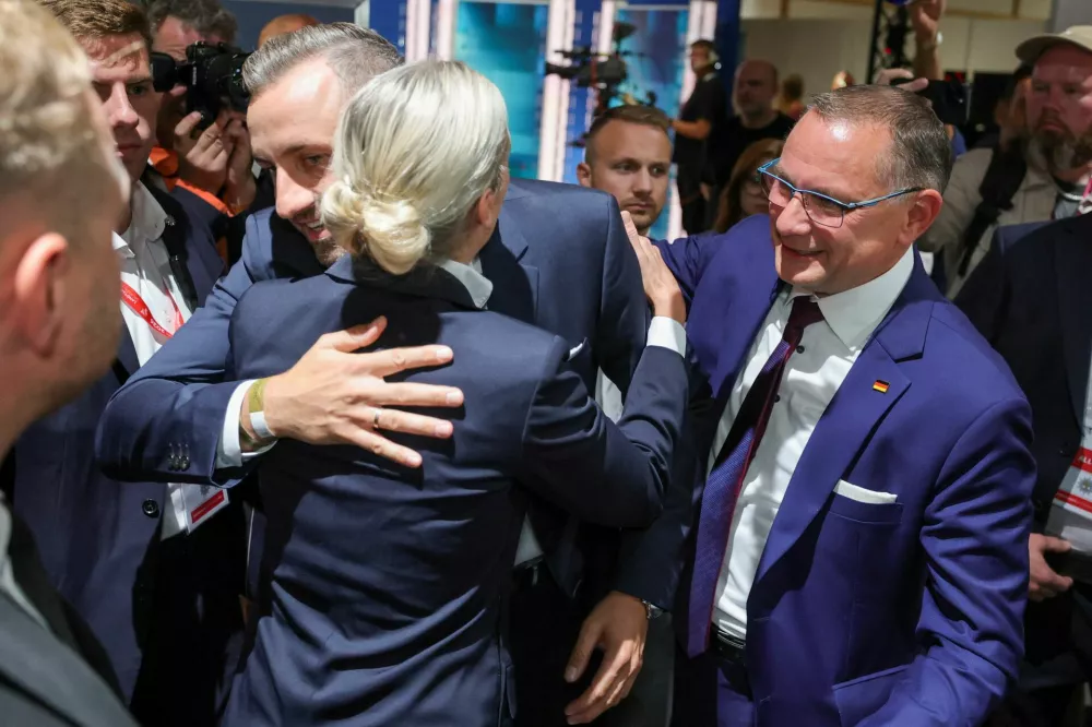 Top candidate of the far-right Alternative for Germany (AfD), Ulrich Siegmund, with party co leaders Alice Weidel and Tino Chrupalla, reacts after polls closed, on the day of the Saxony-Anhalt state elections, in Magdeburg, Germany, September 6, 2026. REUTERS/Fabrizio Bensch