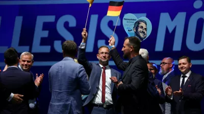 Supporters of far-right Alternative for Germany (AfD) hold German flags after polls closed in the Saxony-Anhalt state elections, in Magdeburg, Germany, September 6, 2026. REUTERS/Thilo Schmuelgen