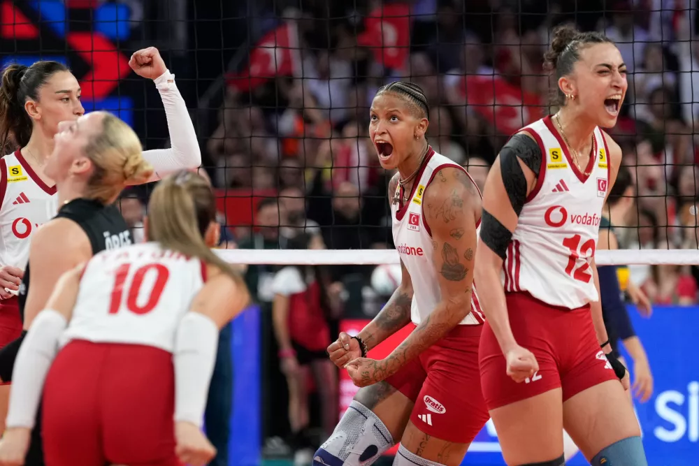 Turkey's Melissa Teresa Vargas and Elif Sahin, right, celebrate a point during the Women's Euro final volleyball match between Italy and Turkey in Istanbul, Sunday, Sept. 6, 2026. (AP Photo/Emrah Gurel)