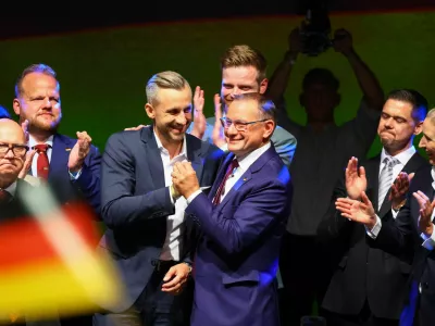 Top candidate of the far-right Alternative for Germany (AfD) Ulrich Siegmund greets Tino Chrupalla onstage at the AfD election party after polls closed in the Saxony-Anhalt state elections and exit polls were announced, in Magdeburg, Germany, September 6, 2026. REUTERS/Fabrizio Bensch