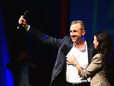 Ulrich Siegmund, left, (AfD), the party's top candidate and co-chair of the AfD state parliamentary group in Saxony-Anhalt, and his wife Julia Siegmund stand on stage at the AfD's election party in Magdeburg, Germany, Sunday, Sept. 6, 2026. (Michael Kappeler/dpa via AP)
