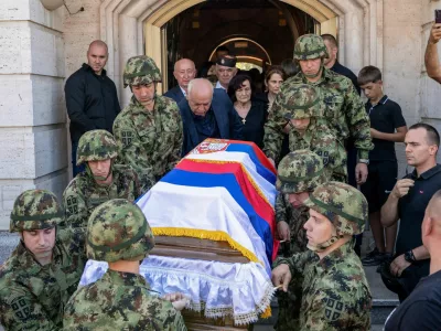 Serbian army soldiers carry the coffin of former Bosnian Serb wartime general Ratko Mladic outside the Church of St. Luke before burial, in Belgrade, Serbia, September 7, 2026. REUTERS/Uros Arsic
