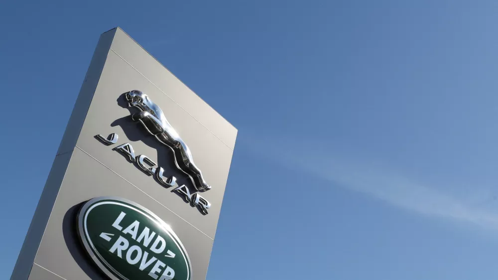 FILE PHOTO: Logos of Jaguar and Land-Rover are seen outside a car dealer, in Brussels, Belgium May 28, 2020. REUTERS/Yves Herman/File Photo