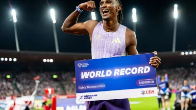 Brazil's Alison dos Santos celebrates winning the men's 400-meter hurdles, setting a new world record, at the Diamond League athletics meeting, Thursday, Aug. 27, 2026, in Zurich, Switzerland. (Jean-Christophe Bott/Keystone via AP)