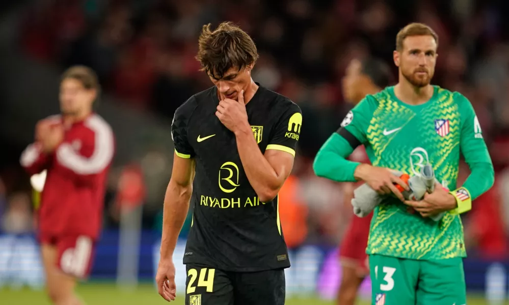 Atletico Madrid's Robin Le Normand and Atletico Madrid's goalkeeper Jan Oblak leave the pitch after losing the Champions League opening phase soccer match between Liverpool and Atletico Madrid in Liverpool, England, Wednesday, Sept. 9, 2026. (AP Photo/Dave Thompson)