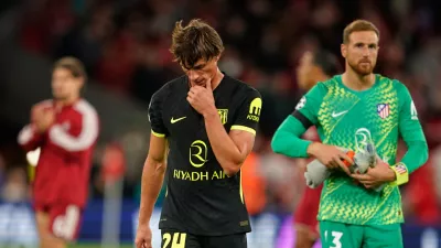 Atletico Madrid's Robin Le Normand and Atletico Madrid's goalkeeper Jan Oblak leave the pitch after losing the Champions League opening phase soccer match between Liverpool and Atletico Madrid in Liverpool, England, Wednesday, Sept. 9, 2026. (AP Photo/Dave Thompson)