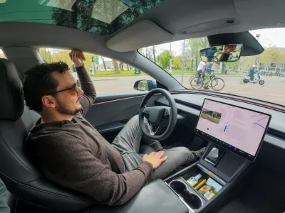 FILE PHOTO: Tesla enthusiast Kees Roelandschap drives around hands-free with his electric car, several days after Dutch regulators approved the use of Tesla's self-driving software, in Amsterdam, Netherlands, April 17, 2026. REUTERS/Bart Biesemans/File Photo