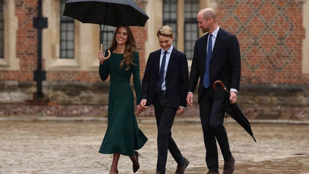 Britain's Kate, Princess of Wales, left, and Britain's Prince William walk with their 13-year-old son, Britain's Prince George, as he arrives for his first day at Eton College, in Eton, west of London, Tuesday, Sept. 8, 2026. (Adrian Dennis/Pool Photo via AP)