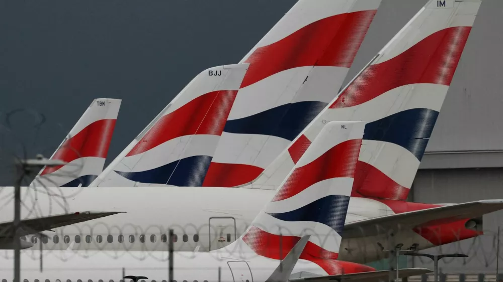 FILE PHOTO: Livery of British Airways passenger planes are seen at Heathrow Airport in west London, Britain, January 28, 2025. REUTERS/Toby Melville/File Photo
