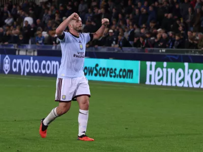 Aston Villa's John McGinn celebrates at the end of the Champions League opening phase soccer match between Club Brugge and Aston Villa in Bruges, Belgium, Tuesday, Sept. 8, 2026. (AP Photo/Omar Havana)