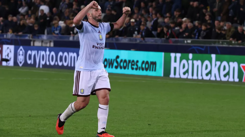 Aston Villa's John McGinn celebrates at the end of the Champions League opening phase soccer match between Club Brugge and Aston Villa in Bruges, Belgium, Tuesday, Sept. 8, 2026. (AP Photo/Omar Havana)