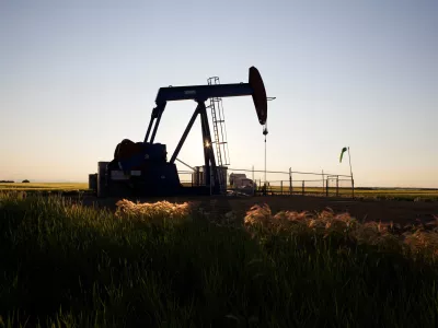 An oil pump jack pumps oil in a field near Calgary, Alberta, July 21, 2014. Pump jacks are used to pump crude oil out of the ground after an oil well has been drilled. REUTERS/Todd Korol