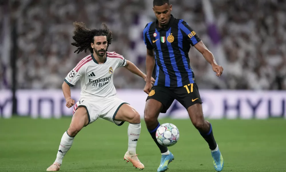 Real Madrid's Marc Cucurella fights for the ball against Inter Milan's Andy Diouf during a Champions League soccer match between Real Madrid and Inter Milan in Madrid, Spain, Tuesday, Sept. 8, 2026. (AP Photo/Bernat Armangue)