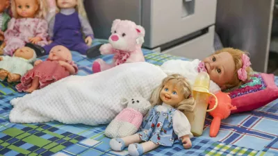 Story from Jam Press (Lives 100 Dolls) Pictured: Some of the dolls from Marie's growing collection.'I live with 100 dolls and talk to them &ndash; I don't care if people think I'm crazy, they're my babies'A woman who lives with 100 dolls and admits to speaking to them says she doesn't care if people think she is crazy.Marie Odendaal started playing with dolls as a way to communicate with her daughter, who has cerebral palsy &ndash; a brain disorder that appears in infancy or early childhood and permanently affects body movement, muscle coordination and can disrupt speech.But now, the 69-year-old has built up a collection of 100 dolls and a thriving business making 400 tiny outfits a week for fellow doll-lovers.And they aren't just toys to her &ndash; but her "babies"."I do talk to my dolls," Marie told What's The Jam."I say good morning to Samantha, but she remains silent - which is expected considering she's a doll."My dolls are my life &ndash; and that's why I talk to them."People can think I'm crazy but I don't care."Marie says she's known as the doll lady because dolls are her passion &ndash; and making outfits for her "babies" and for other doll lovers is her life's work.She said: "I've put some on display before too."Some in elegant evening gowns, a wedding dress, swimming costumes and cheerful summer frocks."And a Ken doll wearing camouflage trousers."He's turned away from the girls next to him."Maybe it's the delicate items of underwear I create that have made him coy."People ask why I make underwear for dolls and I say, 'Don't you teach your children to always wear underwear?'."Marie is proud of her work.Every design, every piece of thread, every little flower or bead is selected with care and the stitching is done painstakingly by hand or on her sewing machine.She said: "I can't stand shoddy work."This is my full-time job, after all."But it's about more than just income."It was the one thing both her and her daughter Jolanda, now 50, really loved when she was a child.She said: "We played with them together."Samantha is Jolanda's doll."Jolanda lives in a care home but sleeps on the bed in the kitchen when she comes home for holidays."And the money from selling doll clothes helps pay for Jolanda's care.Marie, from Kempton Park, South Africa, said: "I make about 30 outfits a day &ndash; that's about 400 items a week."As I work I also talk to my dolls."Samantha is Jolanda's baby but she stays with me because she needs to be looked after."And for me, she's a piece of Jolanda I can still have every day."Her unique home enterprise allows her to combine her two big loves &ndash; dolls and making clothes.Decades ago, after divorcing her first husband, the mum-of-three did a needlework course and started making and selling every-thing from wedding dresses to daywear in order to supplement her income as an office worker.She also made little outfits for her own dolls purely as a hobby.Between the dressmaking, she cared for Jolanda, who has never been able to walk.She said: "I carried her from one place in the house to another."But 10 years ago my body started giving in."I've had five back operations and two hip replacements and Jolanda had to go to a care facility because I could no longer manage her alone."But even after that Marie was determined to keep working.She said: "I'm not one for pottering about, reading or watching TV."Needlework is what I do."And anyway, I still have to somehow pay for my daughter's necessities."Marie's second husband, Rudi, 66, is often away from home due to his work as a fitter and turner on the mines.He built her worktable and helped set up her "production line" &ndash; her sewing machines, plastic containers full of materials and accessories, tiny dress patterns laid out, fabrics, scissors, spools of thread and containers with pins.She said: "It's colourful chaos that fills every corner, but everything is exactly the way I want it."I switched to making doll clothes because it's easier than making outfits for people."You can also cut and stitch more clothes from one roll of fabric."And I love what I do."She has five big clients she supplies doll clothes to wholesale, and they sell them in shops across the country.She said: "Then there are also people who drive from as far as Kimberley to buy things for their children."I'm not expensive be cause I want every child to have little clothes for their dolls."They go as far away as South Africa, Australia and Europe."And her husband doesn't mind.He has his own passion &ndash; his classic Ford Cortina, which he works on when he's home.She said: "I always tell him his hobby costs us money, but mine actually makes money."I still love playing with dolls &ndash; it's what my daughter and I have always done."I also had a friend who would come over and play with me and we held everything from doll tea parties to weddings over the years."The dolls still come out of their boxes sometimes."ENDS,Image: 1055112948, License: Rights-managed, Restrictions:, Model Release: no 