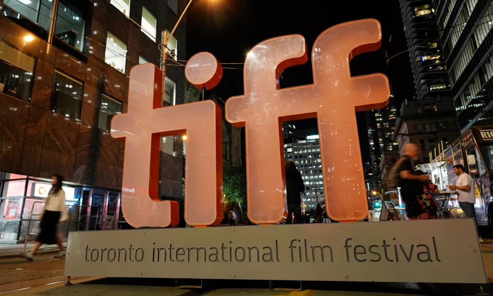 FILE - A sign for the Toronto International Film Festival appears on the opening night of the festival in Toronto on Sept. 5, 2024. (AP Photo/Chris Pizzello, File)