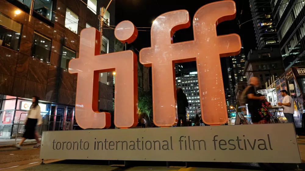 FILE - A sign for the Toronto International Film Festival appears on the opening night of the festival in Toronto on Sept. 5, 2024. (AP Photo/Chris Pizzello, File)