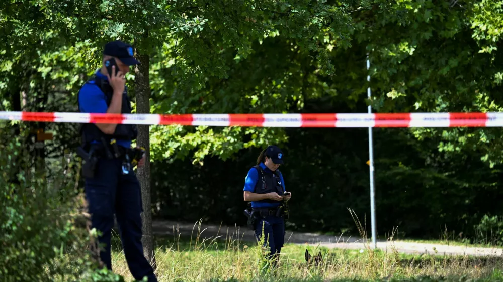 Police stand next to barricade tape near the site of a deadly shooting at a rave party, according to the police, at Schachen in Aarau, Switzerland, August 30, 2026. REUTERS/Romina Amato   TPX IMAGES OF THE DAY