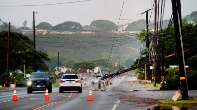Downed power lines caused by Hurricane Lowell are seen across a road after on Tuesday, Sept. 8, 2026 in PoÊ»ipÅ« on KauaÊ»i's south shore, in Hawaii. (Kevin Fujii/Honolulu Civil Beat via AP)