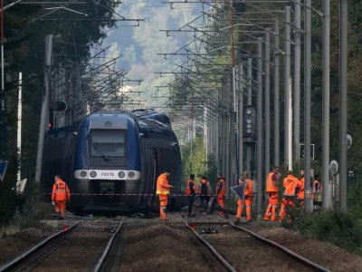 SNCF agents walk around a crashed train in Cleon, northwestern France, on September 12, 2026, one day after a train carrying 180 passengers derailed, injuring4 44 people. In total 44 people were injured, including a young woman evacuated "in absolute emergency" in the derailment on the evening of September 11, 2026, of a TER train that was carrying 186 passengers between Rouen and Caen, according to the Seine-Maritime prefecture and the public prosecutor's office.,Image: 1133705538, License: Rights-managed, Restrictions:, Model Release: no 
