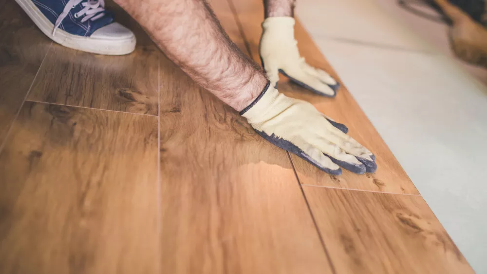 Flooring technology - laying of a floating laminate floor - eco-friendly finishing material