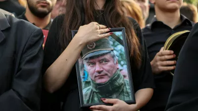 FILE PHOTO: People attend a funeral of former Bosnian Serb wartime general Ratko Mladic at the Topcider Cemetery in Belgrade, Serbia, September 7, 2026. REUTERS/Zorana Jevtic/File Photo