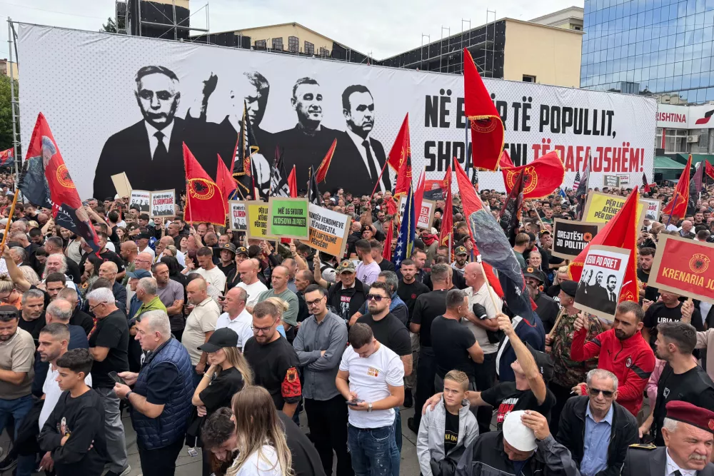 People rally in Pristina, Kosovo, Saturday, Sept. 12, 2026, in support of the former president Hashim Thaci and the other defendants, Kadri Veseli, Rexhep Selimi and Jakup Krasniqi ahead of their verdicts next week at a Netherlands-based court which tried them for alleged war crimes during a 1998-1999 separatist war from Serbia. (AP Photo/Zana Cimili)
