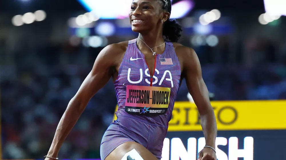 Athletics - 2026 World Athletics Ultimate Championships - National Athletics Centre, Budapest, Hungary - September 12, 2026 Melissa Jefferson-Wooden of the U.S. celebrates as she crosses the line to win the Women's 100m final REUTERS/Bernadett Szabo