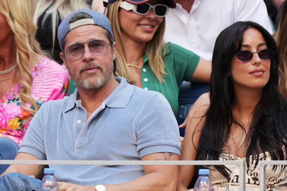 Actor Brad Pitt, left, and Ines de Ramon attend a match between Aryna Sabalenka, of Belarus, and Elena Rybakina, of Kazakhstan, during the women's singles final of the U.S. Open tennis championships Saturday, Sept. 12, 2026, in New York. (AP Photo/Kirsty Wigglesworth)