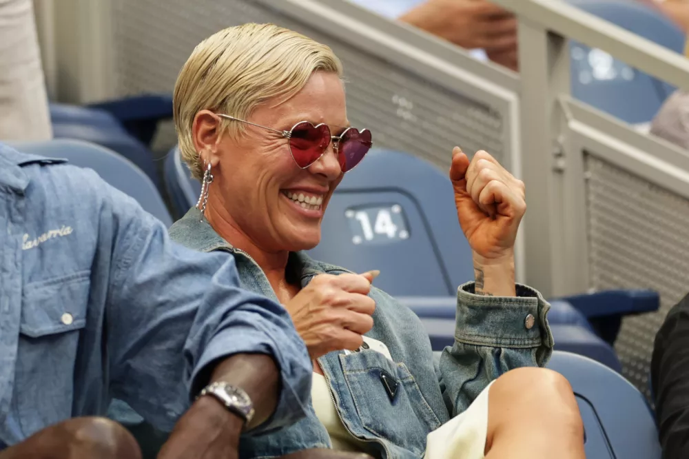 Pink attends a match between Aryna Sabalenka, of Belarus, and Elena Rybakina, of Kazakhstan, during the women's singles final of the U.S. Open tennis championships Saturday, Sept. 12, 2026, in New York. (AP Photo/Adam Hunger)