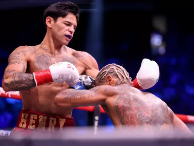 Ryan Garcia, left, punches Conor Benn in their welterweight championship fight Saturday, Sept. 12, 2026, in Las Vegas. (AP Photo/Ian Maule)