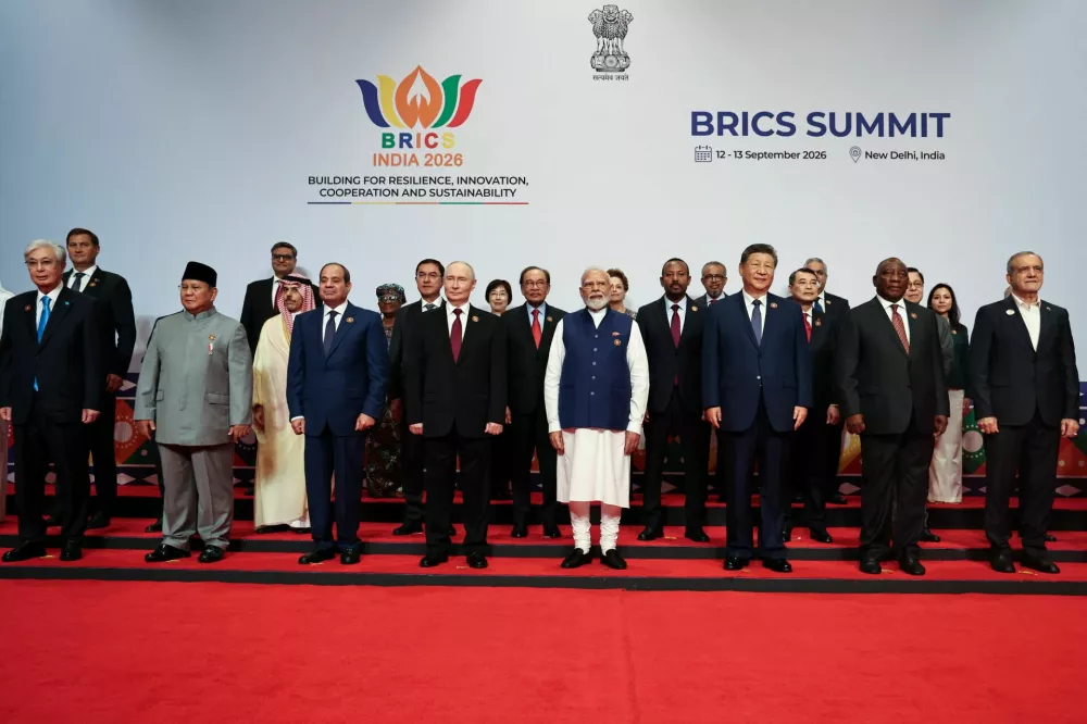 Heads of delegations, including Kazakh President Kassym-Jomart Tokayev, Indonesian President Prabowo Subianto, Egyptian President Abdel Fattah al-Sisi, Russian President Vladimir Putin, Indian Prime Minister Narendra Modi, Chinese President Xi Jinping, South African President Cyril Ramaphosa, Iranian President Masoud Pezeshkian, Saudi Foreign Minister Prince Faisal bin Farhan Al-Saud, Uzbekistan Deputy Prime Minister Jamshid Kuchkarov, Malaysian Prime Minister Anwar Ibrahim, Ethiopian Prime Minister Abiy Ahmed, Vietnam's Prime Minister Le Minh Hung, pose for a family photo on day two of the BRICS Summit in New Delhi, India, September 13, 2026. Sputnik/Alexander Kazakov/Pool via REUTERS ATTENTION EDITORS - THIS IMAGE WAS PROVIDED BY A THIRD PARTY.