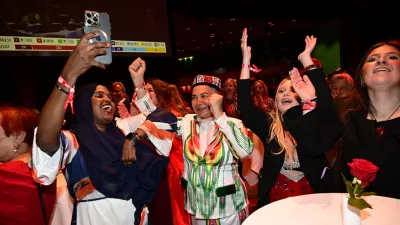 Social Democrats react to the presentation of the exit poll at the Social Democrats' election night watch party, in Stockholm, Sunday, Sept. 13, 2026. (Jonas Ekstr&ouml;mer/TT News Agency via AP)