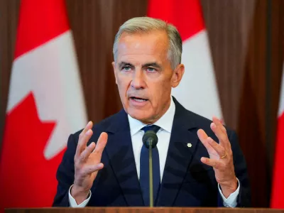 FILE PHOTO: Canada's Prime Minister Mark Carney speaks with the news media after he suspended trade negotiations with the United States, in Ottawa, Ontario, Canada August 22, 2026. REUTERS/Chris Tanouye/File Photo