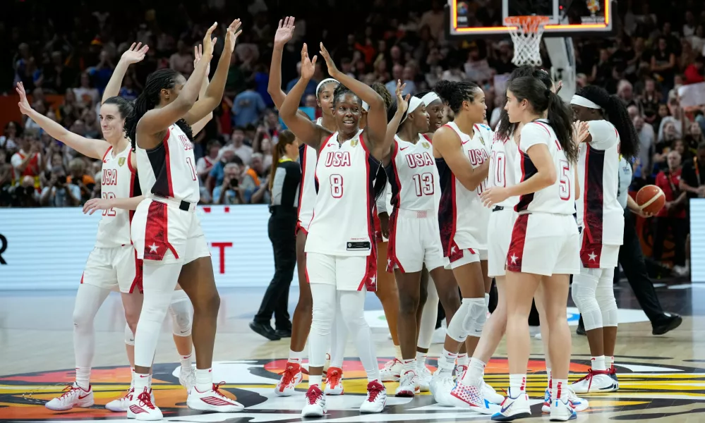 United States players celebrate after the Women's Basketball World Cup final match between the United States and France in Berlin, Sunday, Sept. 13, 2026. (AP Photo/Ebrahim Noroozi)