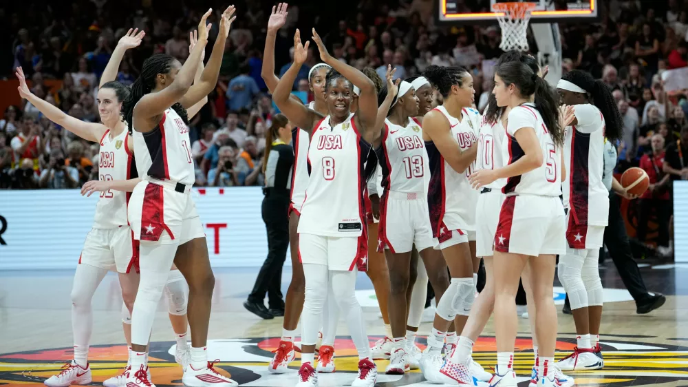 United States players celebrate after the Women's Basketball World Cup final match between the United States and France in Berlin, Sunday, Sept. 13, 2026. (AP Photo/Ebrahim Noroozi)
