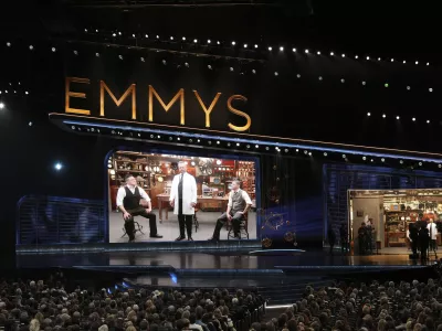 Bowen Yang, from left, Host Nate Bargatze, and Mikey Day during the 77th Primetime Emmy Awards on Sunday, Sept. 14, 2025, at the Peacock Theater in Los Angeles. (AP Photo/Chris Pizzello)