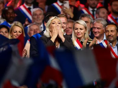 Marine Le Pen, French far-right leader and member of parliament, who is running in the 2027 French presidential election for the Rassemblement National (National Rally - RN), blows a kiss to the crowd as she delivers a speech in Henin-Beaumont, northern France, September 13, 2026. REUTERS/Sarah Meyssonnier