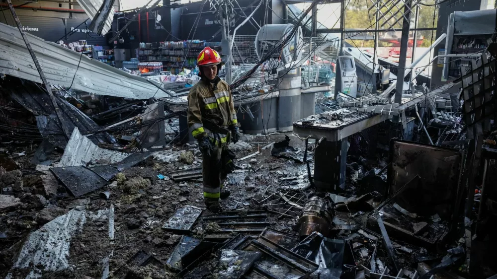 A firefighter inspects the site of a supermarket hit by a Russian drone strike, amid Russia's attack on Ukraine, in Chernihiv, Ukraine July 26, 2026. REUTERS/Maksym Kishka