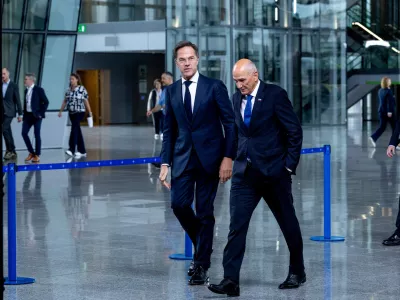 NATO Secretary General Mark Rutte, left, and Slovenian Prime Minister Janez Jansa speak to each other prior to a meeting at NATO headquarters in Brussels, Monday, Sept. 14, 2026. (AP Photo/Omar Havana)