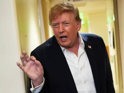 President Donald Trump speaks with reporters while in flight on Air Force One from Shannon, Ireland to Joint Base Andrews, Md., Sunday, Sept. 13, 2026. (AP Photo/Julia Demaree Nikhinson)