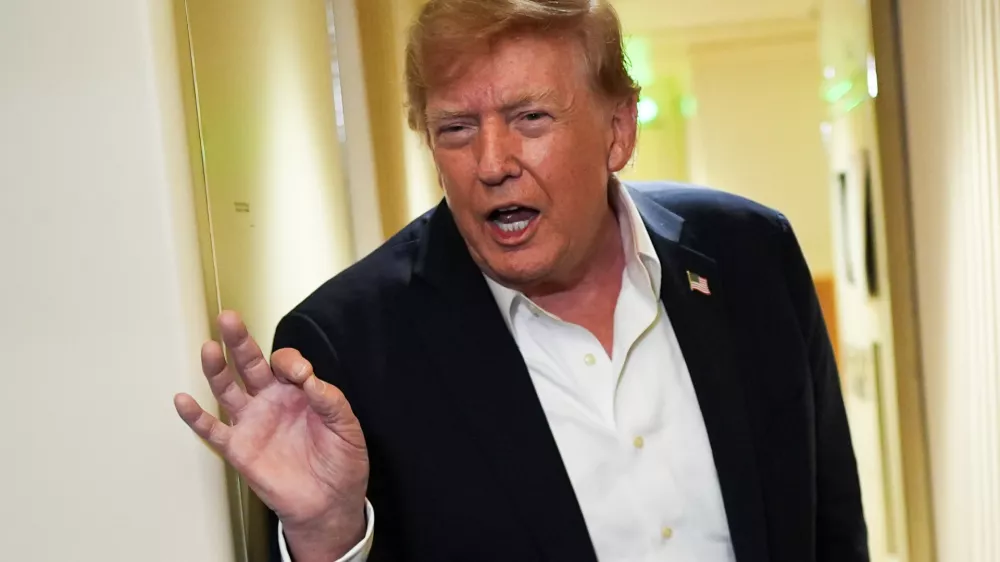 President Donald Trump speaks with reporters while in flight on Air Force One from Shannon, Ireland to Joint Base Andrews, Md., Sunday, Sept. 13, 2026. (AP Photo/Julia Demaree Nikhinson)