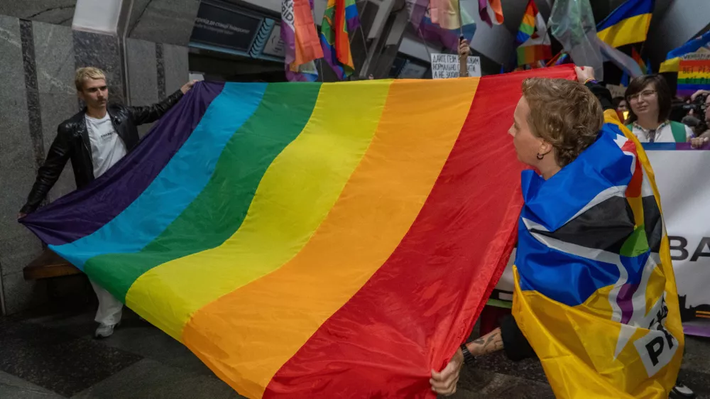 LGBTQ+ activists hold a rally at an underground metro stationto be protected from Russian regular air attacks in central Kharkiv, Ukraine, Saturday, Sept. 12, 2026. (AP Photo/Andrii Marienko)