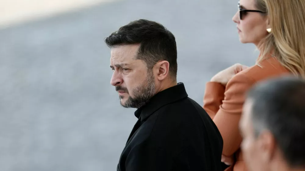 Ukraine's President Volodymyr Zelenskiy and his wife Olena Zelenska attend the annual Bastille Day military parade on the Champs-Elysees avenue in Paris, France, July 14, 2026. REUTERS/Benoit Tessier