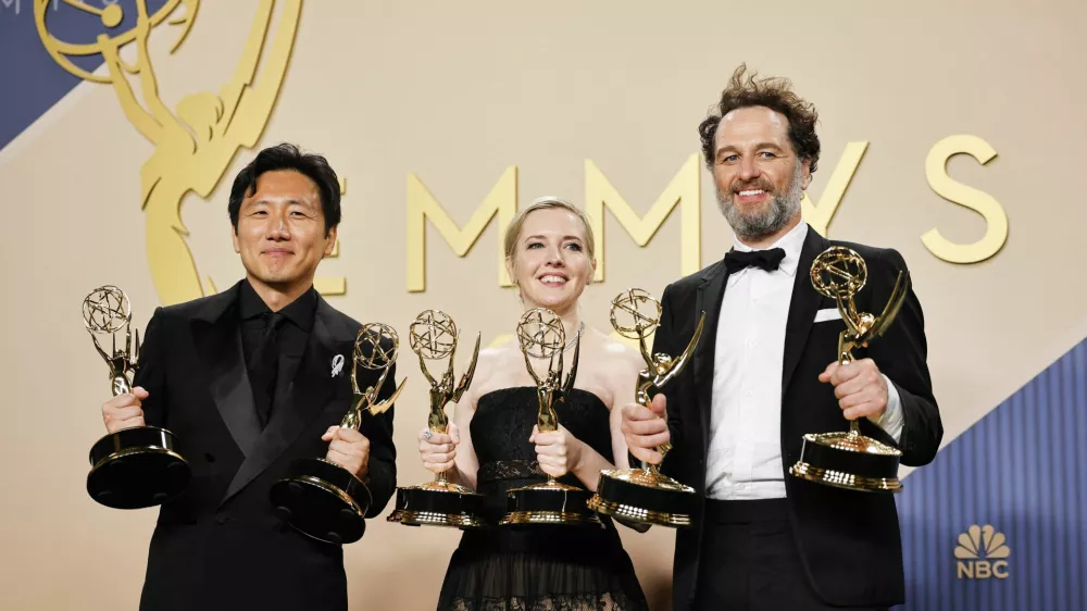 Hiro Murai, winner of the Outstanding Directing for a Comedy Series Award for "Widow's Bay", Katie Dippold, winner of the Outstanding Writing for a Comedy Series Award for "Widow's Bay" and Matthew Rhys, winner of the Outstanding Lead Actor in a Comedy Series Award for "Widow's Bay" and winner of the Outstanding Lead Actor in a Limited or Anthology Series or Movie Award for "The Beast in Me," pose with their awards during the 78th Primetime Emmy Awards in Los Angeles, California, U.S., September 14, 2026. REUTERS/Mike Blake