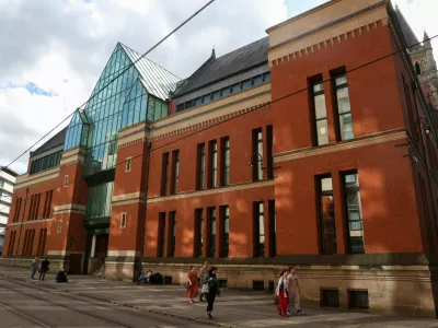 People walk past the Minshull Street Crown Court, as 13 men go on trial charged with serious sexual &zwnj;offences against the same woman, who is the wife of one of the accused, in Manchester, Britain, September 14, 2026. REUTERS/Temilade Adelaja